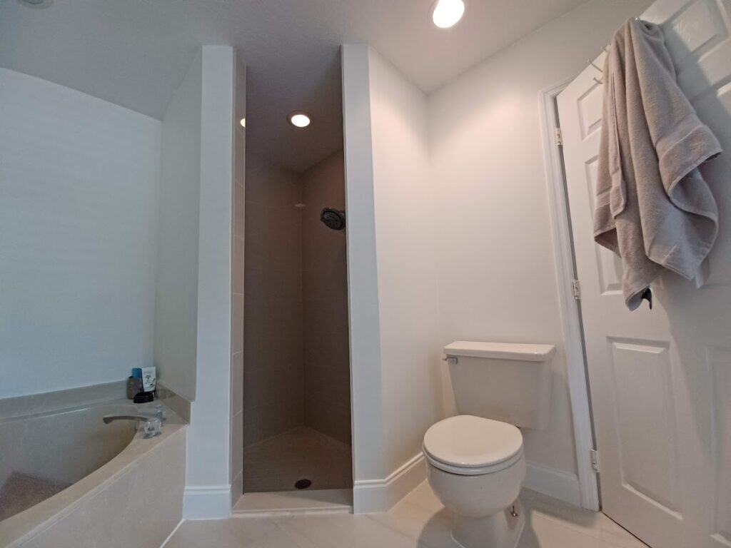 After water damage repair in bathroom at a home in Palm Bay FL showing repaired and painted drywall