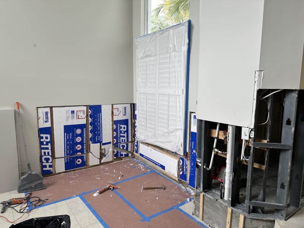 Before water damage repair in Palm Bay FL showing cut out drywall
